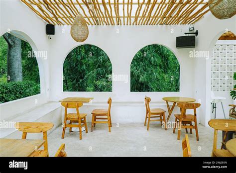 Mediterranean Glassless Arched Windows With Lush Greenery Views