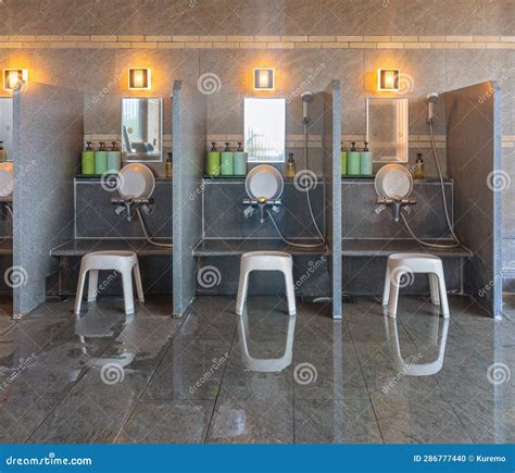 Shower Space Of A Traditional Japanese Indoor Onsen Hot Spring With Bath Chairs And Buckets