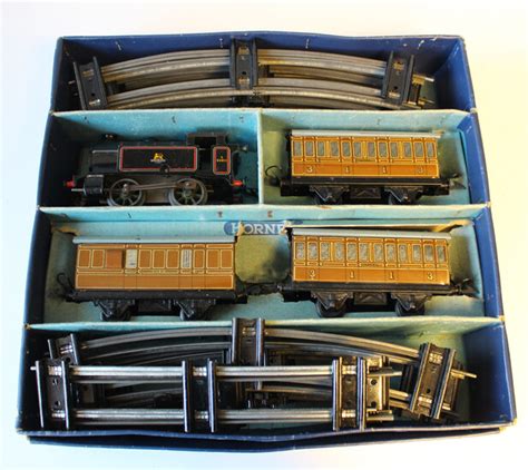 A Hornby Gauge O Clockwork Passenger Train Set Comprising 0 4 0