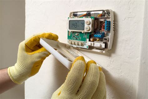 How To Replace Batteries In An Emerson Thermostat - HVACseer.com