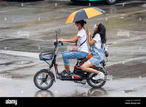 Samut Prakan Thailand Mar Two Women With Umbrellas Ride An