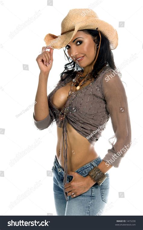 Super Sexy Rodeo Cowgirl In Torn Jeans Boots And Cowboy Hat Stock