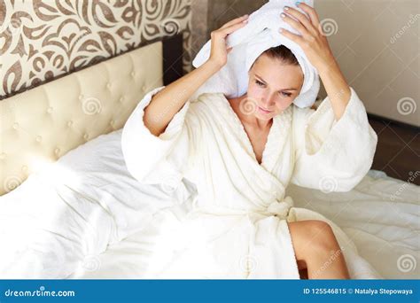Beautiful Brunette Girl With A Towel On Her Head In Bed She Was Taking A Shower Stock Image