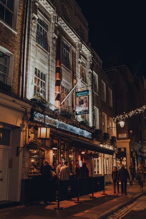 People Drinking Outside The Two Brewers Greene King Pub In Covent