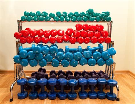 Rack with Colored Dumbbells Stock Image - Image of multicolored ...