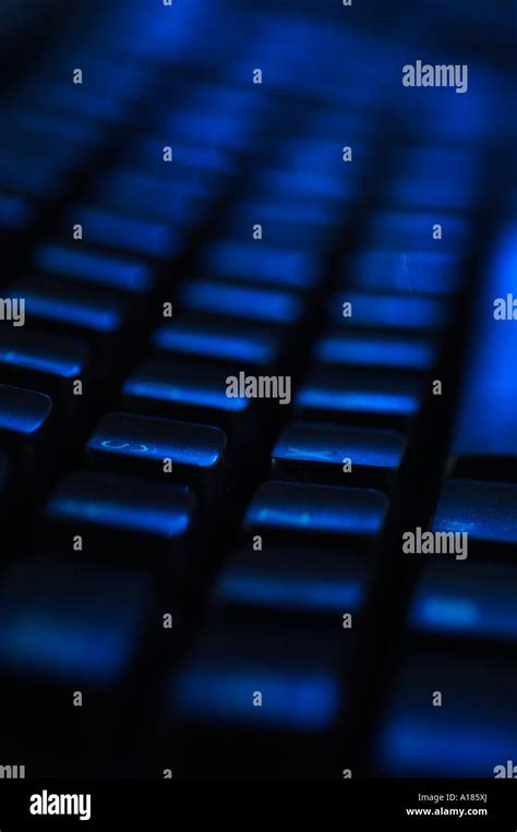 Computer Keyboard with blue lighting Stock Photo - Alamy