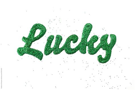 The Word Lucky Spelled With Green Glitter By Stocksy Contributor