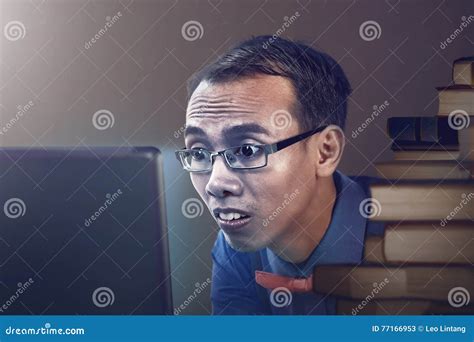 Nerdy Man Studying With Laptop Stock Image Image Of Glaring Asian