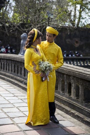 Wedding Couple In Traditional Clothes At Royal Palace In Hue Vi