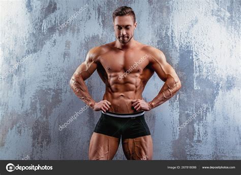 Portrait Of Strong Healthy Handsome Athletic Man Fitness Model Posing