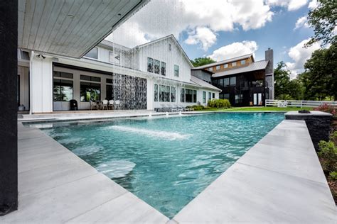 Modern Farmhouse Waterfall | Project | Backyard Paradise Luxury Pools