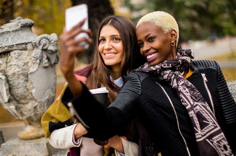 Premium Photo Multiracial Female Friends Taking Selfie Outdoor