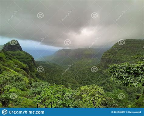 Pic Of Lush Green Mountains With Grey Clouds Stock Image Image Of