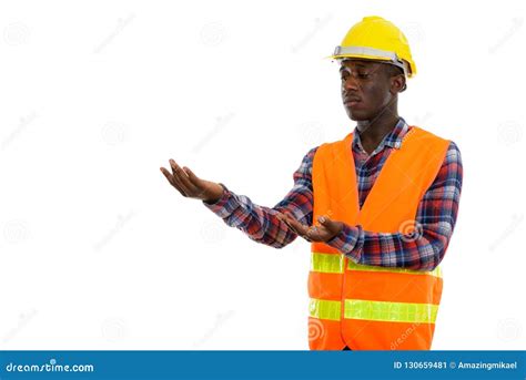 Studio Shot Of Young Black African Man Construction Worker Showi Stock