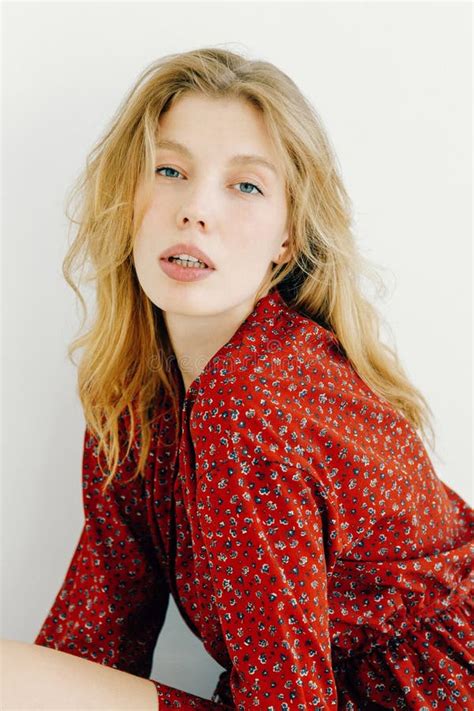 Sunny Portrait Of A Girl In The Studio Smiling Blonde In A Red Dress Stock Image Image Of