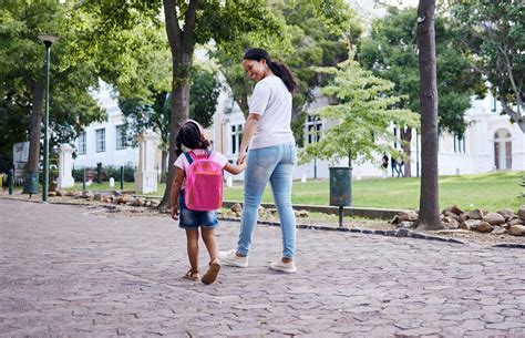 premium photo kindergarten student  mother  daughter walking