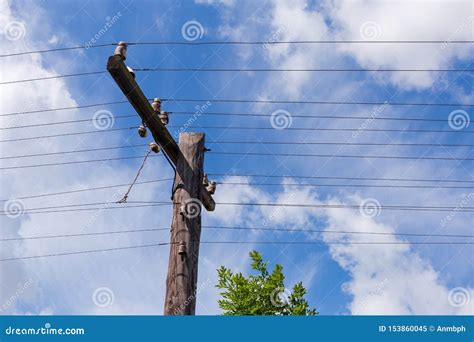 Old Wooden Telegraph Pole With Spar Insulators And Open Wires Stock