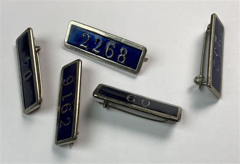 TIPS METÁLICOS NÚMEROS DE IDENTIFICACIÓN DE AGENTES DE POLICÍAS LOCALES