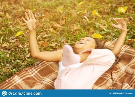 Happy African American Kid In Park The Girl Rejoices And Laughs Child