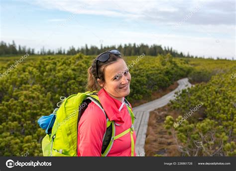 Attractive Brunette Inviting To Explore Nature With A Smile Stock Photo By Anze Bizjan