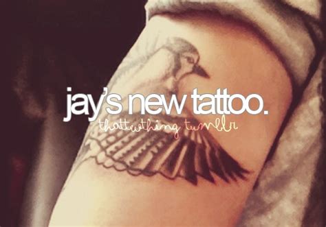 a person with a tattoo on their arm and the words jays new tattoo above it