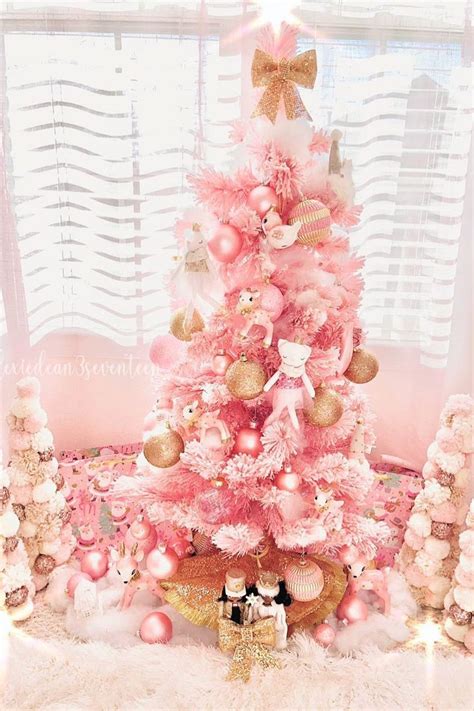 A Pink Christmas Tree With Gold Ornaments And Teddy Bears On The Bottom