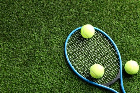 Tennis Racket And Balls On Green Grass Flat Lay Space For Text Stock