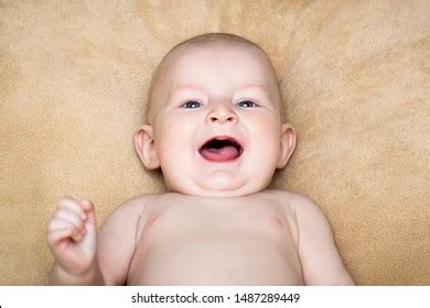 Smiling Naked Baby On Beige Background Stock Photo 1487289449 Shutterstock