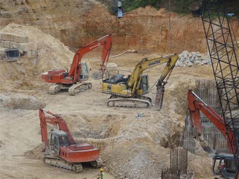 Heavy Construction Machines Doing Building Foundation Works at the ...