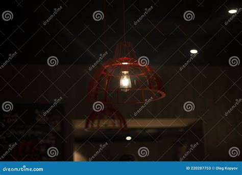 Light Bulb in the Interior. Light Bulb in a Dark Room Stock Image ...