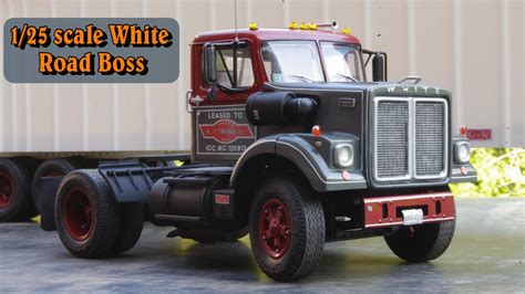 125 Scale White Road Boss Looking Back At An Older Model Truck