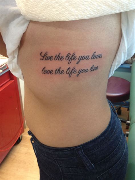 Live the life you love, love the life you live- tattoo on ribs | Life