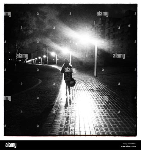 Walking alone night hi-res stock photography and images - Alamy