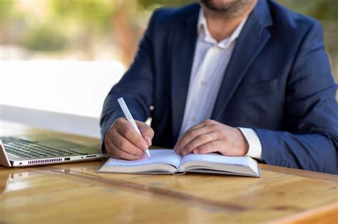 Premium Photo A Mature Business Man In An Outdoor Ambition Working In A Laptop And Phone Dress