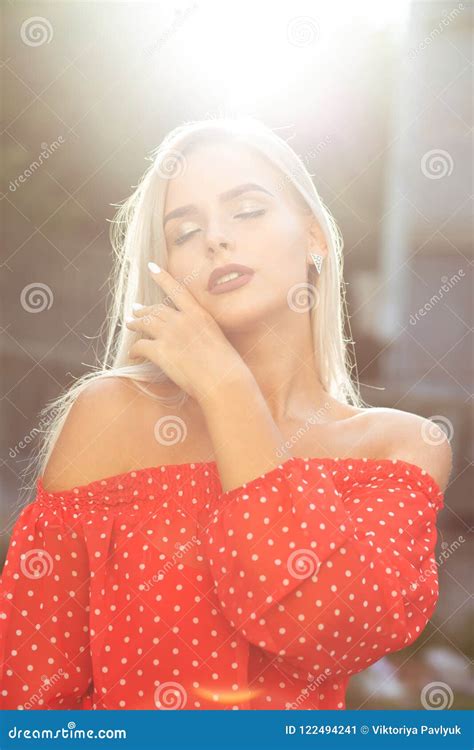 Stylish Blonde Model With Naked Shoulders In Red Dress Posing O Stock Image Image Of