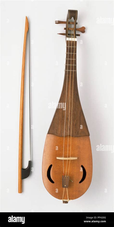 Rebec Medeival Pear Shaped Stringed Instrument And Bow Stock Photo