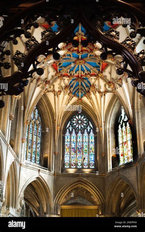 Stained Glass Windows And Decorative Ceiling In Apse Of Tewkesbury