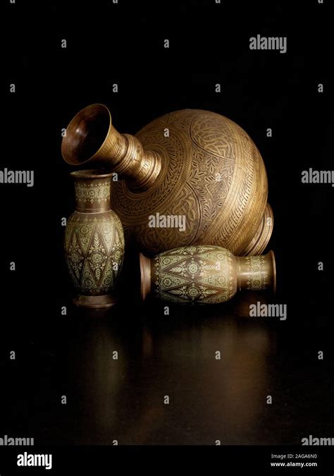 Classical Still Life Setting With Brass And Copper Urn And Vases