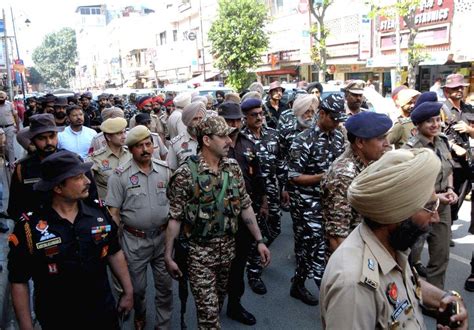 Police And Paramilitary Forces Conduct A Flag March Ahead Of The Upcoming Lok Sabha Elections