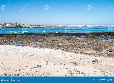 Surfers in the Beach of Corralejo Bay Editorial Photography - Image of ...