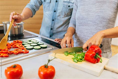 Couple Cooking In The Kitchen By Stocksy Contributor Victor Torres