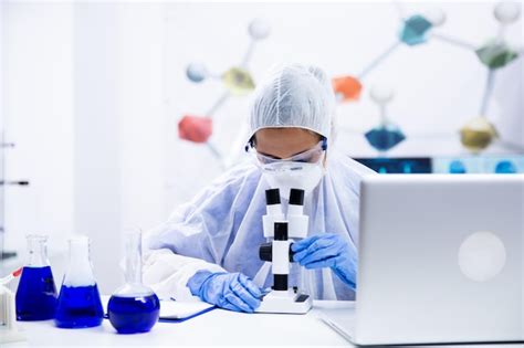 Premium Photo Scientists Women In Blue Glove Adjusting Their