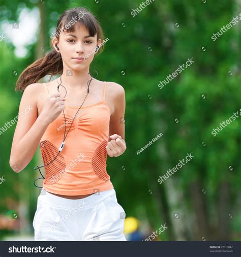 Beautiful Teenage Girl Running In Green Park On Sunny Summer Day Stock ...