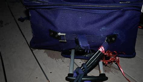 Grisly Photos Show Luggage Containing Womans Remains