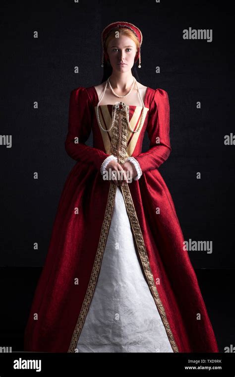 Tudor Woman In Red Dress On Black Background Stock Photo Alamy