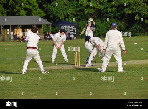 Batsman defending his wicket Stock Photo - Alamy