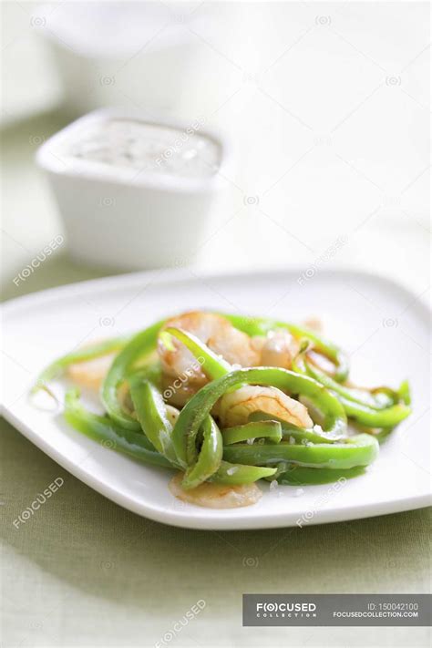 A Jerusalem artichoke medley with sesame seed paste on white plate