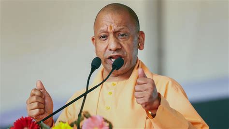 Up Cm Yogi Adityanath Holds Roadshow In Mainpuri Greeted By Supporters Riding On Bulldozers