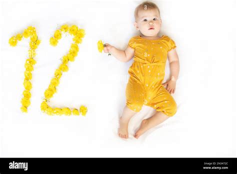 12-month-old baby girl. Baby milestone two months. Twelve month old baby Stock Photo - Alamy