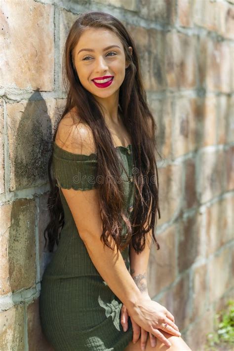 A Lovely Brunette Model Enjoys An Spring Day Outdoors Stock Photo Image Of Feminine Freedom
